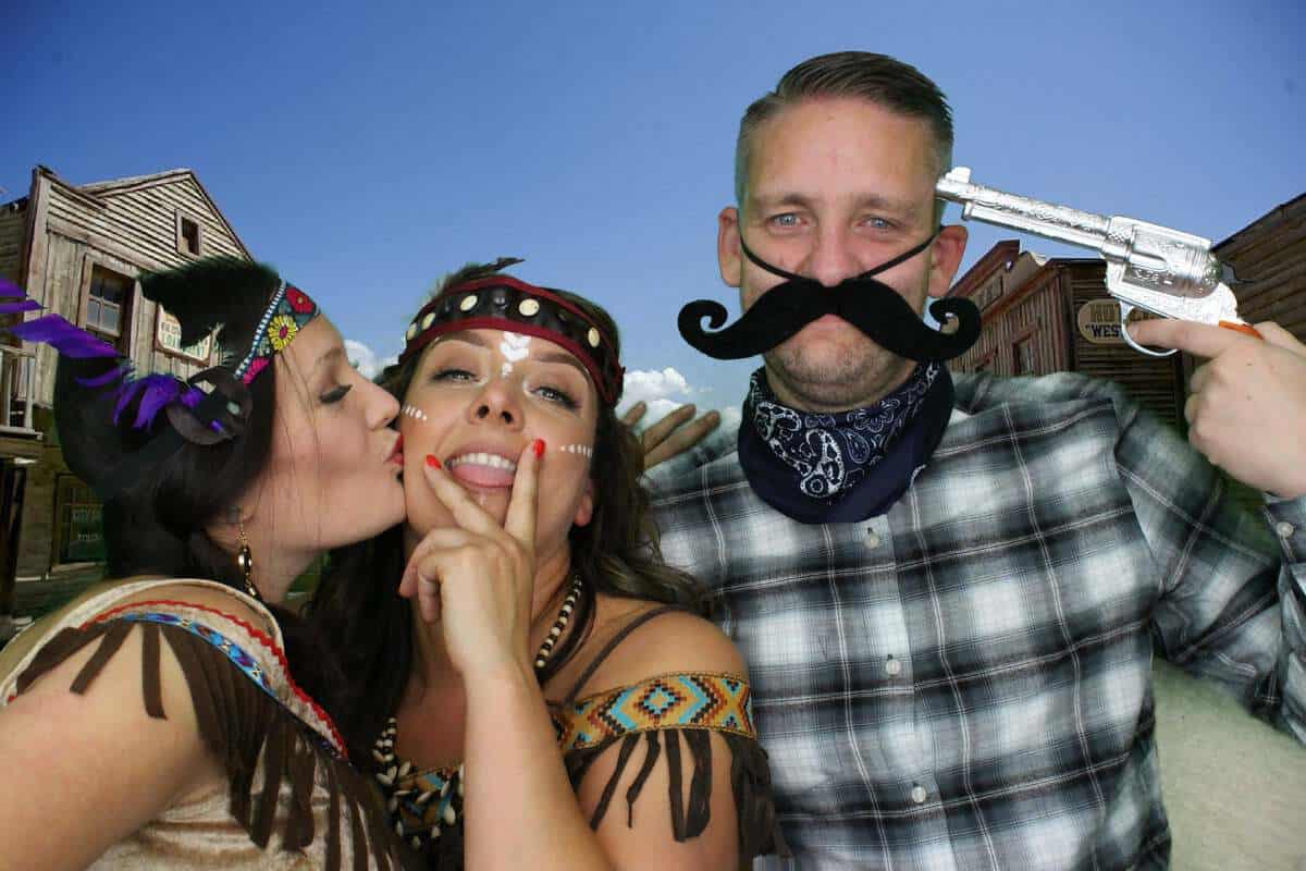 picture of guests enjoying the wild west saloon bar photo booth